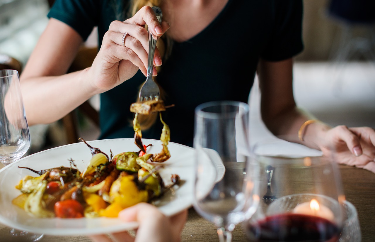 Woman Eating Dinner in a Restaurant